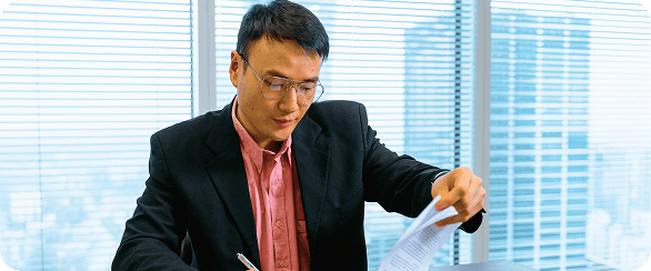 Sales professional reviewing an RFP document, using NSOffice.AI's AI-driven analysis to assess win probability